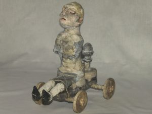 Stroff Denis :'The ride' 2011 Wood papier-mâché acryl paint mixed  media H 29cm x L 17cm x D 27cm